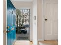 Inviting foyer featuring a bright blue door and a glimpse of the neighborhood, with a welcoming and stylish entrance at 133 Wentworth St, Charleston, SC 29401