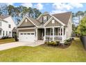 Charming exterior view showcasing a two-story home with a welcoming porch and manicured lawn at 1502 Checker Ct, Mount Pleasant, SC 29466