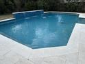 A luxurious backyard pool features a soothing water feature and a well-maintained patio at 1535 Watoga Way Way, Mount Pleasant, SC 29466