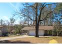 Detached three-car garage offering ample space and a carport at 2015 Albert Storm Ave, Moncks Corner, SC 29461