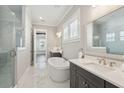 Elegant bathroom with a soaking tub, double vanity, and marble tile flooring at 2123 Boatwright Rd, Johns Island, SC 29455