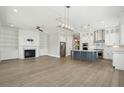 Bright and airy living room and kitchen combination with a fireplace and stainless steel appliances at 2123 Boatwright Rd, Johns Island, SC 29455