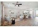 Open-concept living room with hardwood floors and lots of natural light at 221 Abercom Place Dr, Moncks Corner, SC 29461
