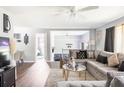 Spacious living room with wood floors and stylish gray decor and large sectional at 2916 Marginal Rd, Charleston, SC 29414