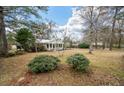 Expansive yard with mature trees and lush greenery, offering a serene outdoor setting for relaxation at 3589 Walter Dr, Johns Island, SC 29455