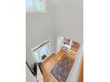 Spacious entryway with hardwood floors, natural light, and a view of the staircase at 652 E Hobcaw Dr, Mount Pleasant, SC 29464