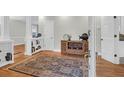 Inviting entryway with hardwood floors, decorative rug, and stylish furnishings at 652 E Hobcaw Dr, Mount Pleasant, SC 29464