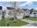 Traditional two-story home with manicured lawn, mature tree, and inviting curb appeal at 1052 Whitlow Blvd, Summerville, SC 29483