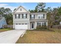 Charming two-story home with a two car garage and a well maintained yard at 150 Rockingham Way, Moncks Corner, SC 29461