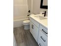 Bathroom featuring white vanity with black hardware, toilet, and shower at 3004 Harvey Ave, North Charleston, SC 29405