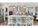 Modern kitchen featuring stainless steel appliances, an island with seating, and pendant lighting at 304 O'Malley Dr, Summerville, SC 29483