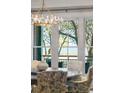 Bright dining room looking out of the large windows with an outside view at 32-E Prioleau St, Charleston, SC 29401