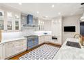 Well-appointed kitchen with custom cabinets, marble countertops and state-of-the-art appliances at 32-E Prioleau St, Charleston, SC 29401