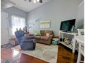 Comfortable living room featuring a plush recliner, cozy sofa, and modern entertainment center, ideal for relaxing at 409 Reserve Way, Summerville, SC 29485