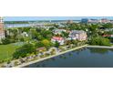 Stunning aerial view of a beautiful waterside community featuring lush greenery, waterways, and grand buildings at 47 Ashley Ave, Charleston, SC 29401