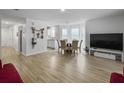 Spacious living room featuring vinyl wood floors and an open layout at 4875 Carnoustie Ct, Summerville, SC 29485