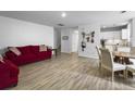 Bright living room featuring wood floors and an open layout at 4875 Carnoustie Ct, Summerville, SC 29485