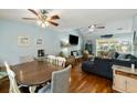 Spacious living room with vaulted ceilings, fireplace, hardwood floors, and comfortable seating at 524 Cobby Creek Ln, Seabrook Island, SC 29455
