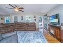 Cozy living room featuring a large sectional, area rug, and entertainment center at 6024 Meadowcliff Ave, Hanahan, SC 29410