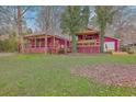 Spacious backyard featuring an outdoor patio area with a large, covered deck perfect for entertainment at 7 Dogwood Ln, Walterboro, SC 29488