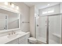Modern bathroom with glass-enclosed shower, white subway tile, and quartz vanity top at 714 Breakers Reef Ln, Huger, SC 29450
