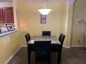 Cozy dining area with a modern table set, complemented by neutral wall color at 7364 Suncatcher Dr, Hanahan, SC 29410