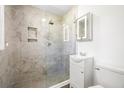 Modern bathroom featuring a glass-enclosed shower with stylish tile work and vanity with storage at 782 Bonham Dr, Charleston, SC 29412