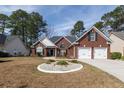 Charming brick home featuring a two-car garage, landscaped front yard, and inviting curb appeal at 109 Presidio Bnd, Summerville, SC 29483