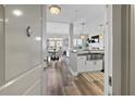 Entryway with a view to the gourmet kitchen featuring stainless steel sink, island and dining room at 145 Pier View St # 403, Charleston, SC 29492