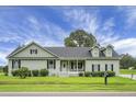 Charming single-story home with inviting porch and well-manicured landscaping on a lush green lawn at 1721 Pimlico Blvd, Moncks Corner, SC 29461