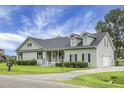 Well-kept single-story home with manicured lawn, classic shutters, and a convenient driveway at 1721 Pimlico Blvd, Moncks Corner, SC 29461