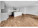 A brightly lit kitchen with gray cabinetry, stainless steel appliances, and hardwood floors at 246 Spencer Cir, Summerville, SC 29485
