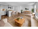 Open-concept living room with a view to the kitchen and dining area filled with natural light at 246 Spencer Cir, Summerville, SC 29485