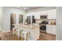 Stylish kitchen featuring stainless steel appliances, a spacious island, and ample cabinet space at 308 Pine Crest View Dr, Summerville, SC 29486
