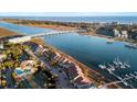 Breathtaking aerial view showcasing waterfront condos, a bridge, and scenic views of the ocean at 46 Mariners Cay Dr, Folly Beach, SC 29439