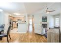 Comfortable open-concept living room features a fireplace and seamless access to kitchen at 700 Daniel Ellis Dr # 13302, Charleston, SC 29412