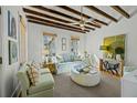 Bright living room features exposed wood beam ceilings and comfortable seating at 78 Nassau St, Charleston, SC 29403