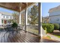 Inviting front porch with dark stained wood floors, seating area, and views of the outdoors at 914 Tupelo Bay Dr, Mount Pleasant, SC 29464