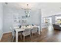 Bright dining room with modern chandelier, stylish table setting, and an open concept design at 1014 Swamp Rose Run, Summerville, SC 29485
