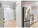 Entry view of a kitchen with stainless steel refrigerator and appliances, and neutral finishes at 1174 Village Creek Ln # 3, Mount Pleasant, SC 29464