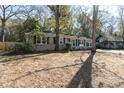 Traditional home with brick facade, black shutters, and green shrubbery at 1239 Wappetaw Pl, Mount Pleasant, SC 29464