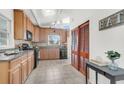 Spacious kitchen with tiled floors, wooden cabinetry, and modern appliances at 1442 N Sherwood Drive Dr, Charleston, SC 29407