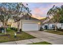 Attractive home displays a well-kept lawn, driveway leading to a two-car garage, and pleasant neighborhood ambiance at 174 Sea Lavender Ln, Summerville, SC 29486