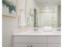 Clean bathroom featuring a large mirror, a double sink vanity, and a shower with a bathtub at 303 Pine Crest View Dr, Summerville, SC 29486