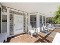 Cozy porch with rocking chairs and a view of the lush greenery at 7938 Pelican Bay Dr, Awendaw, SC 29429