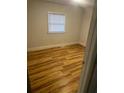 Bright bedroom featuring new laminate flooring and a window at 1202 Forty-One Rd, Saint Stephen, SC 29479
