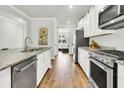 Modern kitchen with stainless steel appliances, granite countertops, and hardwood floors with an open layout at 121 Loon Dr, Summerville, SC 29483