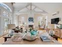 Spacious living room with high vaulted ceilings, fireplace, hardwood floors, and lots of natural light at 14 Guerard Rd, Charleston, SC 29407