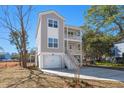 Inviting two-story home featuring a garage, stairway entrance and an inviting driveway at 1439 Periwinkle Dr, Mount Pleasant, SC 29466