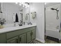 Modern bathroom with updated fixtures, stylish wallpaper, and a shower at 214 Terry Ave, Summerville, SC 29485